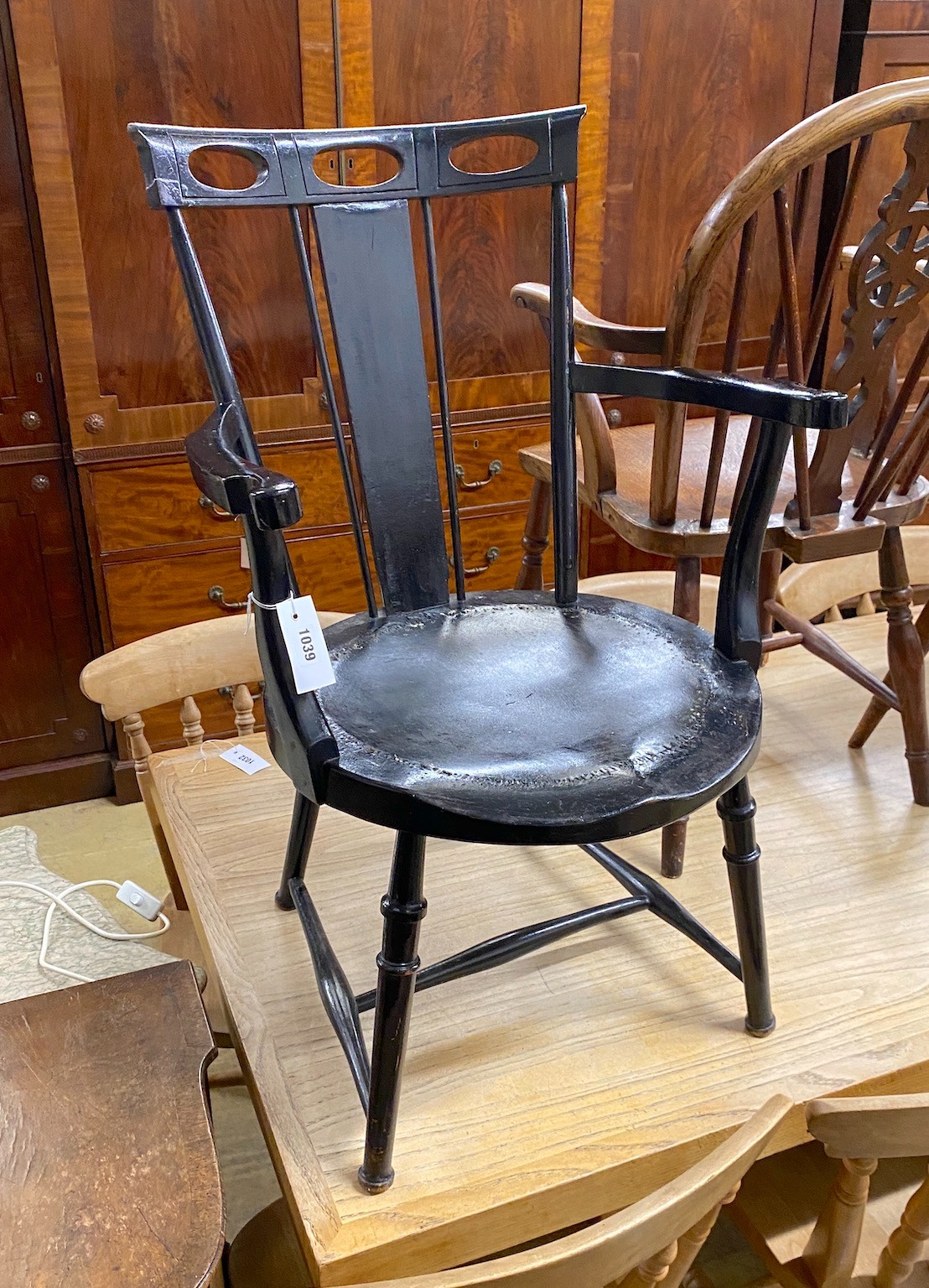 A James Shoolbred ebonised salon chair